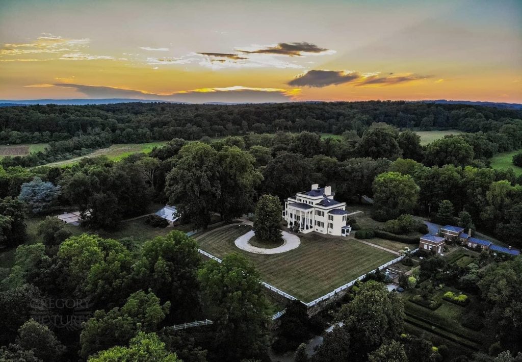 Oatlands drone picture showing the mansion and grounds at sunset.