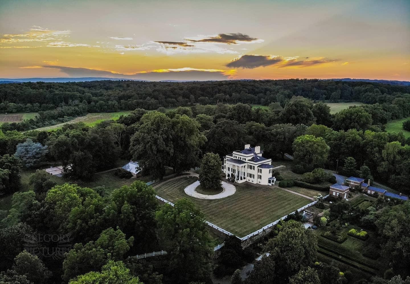 Oatlands drone picture showing the mansion and grounds at sunset.
